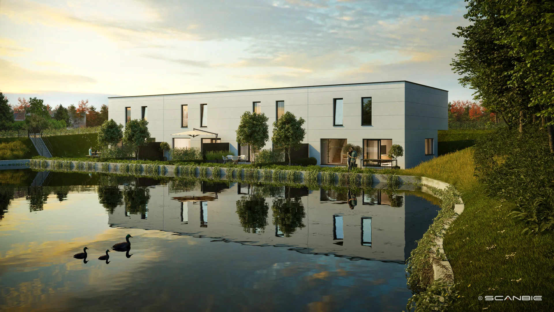 Eden Roc nieuwbouwwoningen aan de waterkant in Lede bij avondlicht